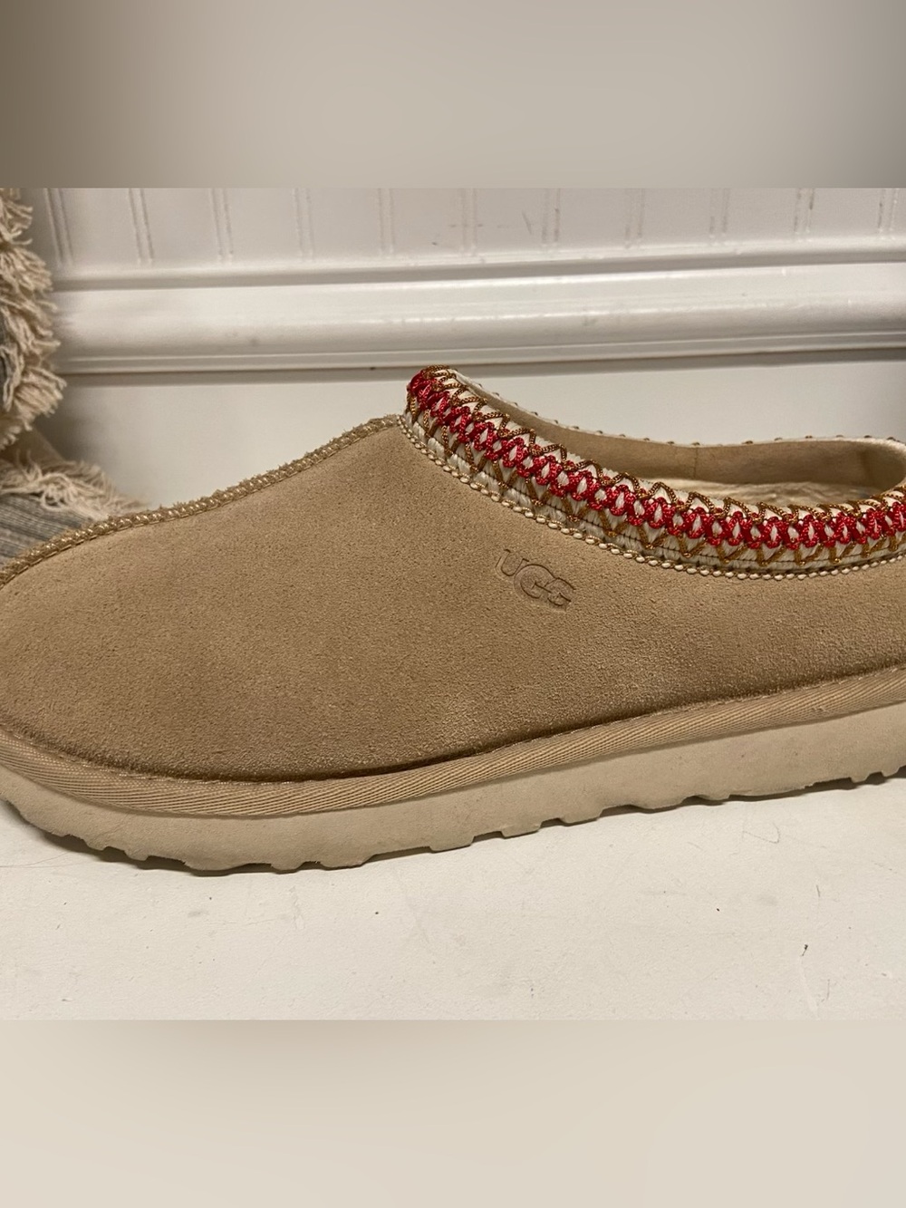 UGG Women’s Tan Suede Slip-On Shoe with Red Accent